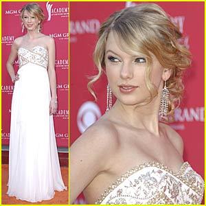 I love her dress and hair-do in this picture. :)