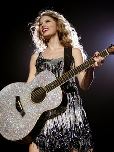 mine taylor with a guitar