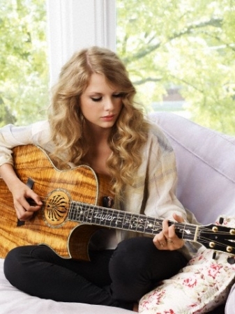 Taylor with a guitar