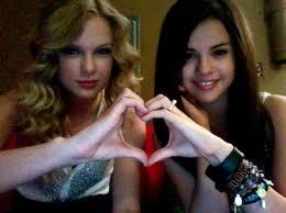 its not just tay makin one but sel to and she still makin a heart

