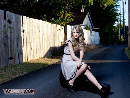 here's mine, Tay sitting on her guitar, this is can or no?