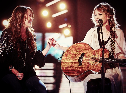  with Miley Cyrus, her guitarra and I think also with a headband and canto <13 (will be awesome if u vote for me..if u like my pic <13)
