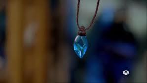 Bella doesn't own a locket. She owns a blue stone that is very special. Later on in the show, Cleo and Rikki get their own blue stone necklaces that will made them. 