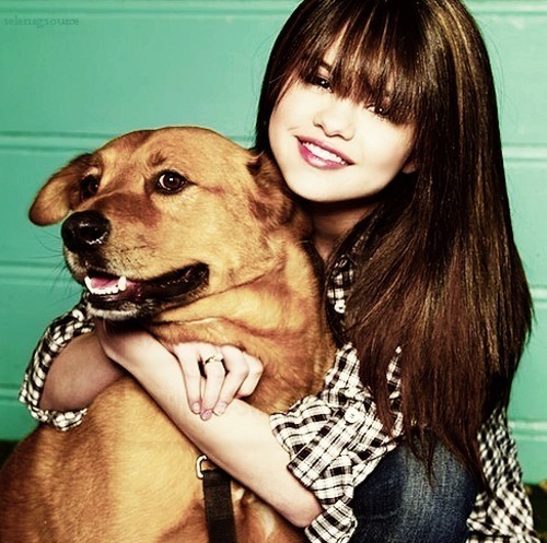 Here <3
-holding something [dog]
-with a pet
-with bangs
-with a jacket