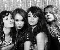  here with demi, miley,selena, and taylor