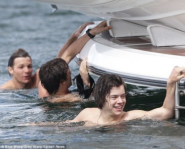 there ya go hes swimming shirtless and you even get Liam and Louis in the background