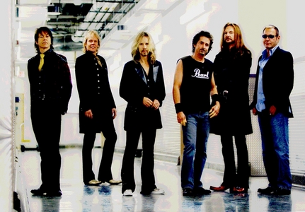  My Favorit band is Styx (pic) My Favorit singer Lawrence Gowan (first guy on the left) who is the singer and keyboardist of Styx (but he used to be a solo artist so it counts as a singer)