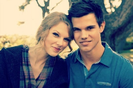 With Taylor Lautner. (a.k.a her best boyfriend)
He's so hot...lol...
