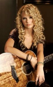  Post a pic of Taylor holding a guitar!!! Props