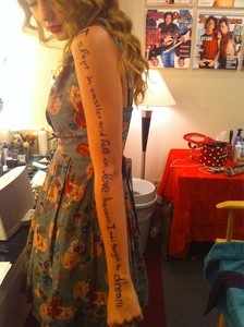  Post a pic where tay has written sth on her arm/hand<3 (not a 13)
