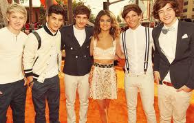 post a pic of selena with someone  ....... here she is with one direction