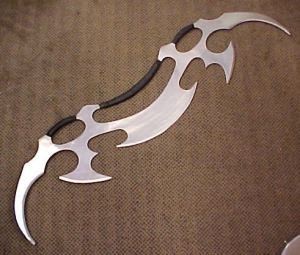  donovan: *suddenly a bat leth (see pic) appears in his hand and attacks him*
