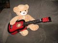 Teddy plays guitar - photography photo