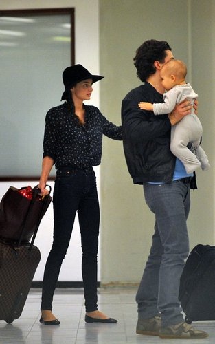 Orlando Bloom with Miranda Kerr and baby Flynn at the airport in Paris, France (September 28).