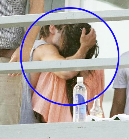 Ashley and Zac kissing and huging on the beach, july 2