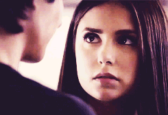 Elena starring at Damon's lips