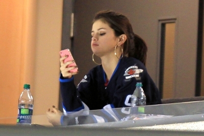  October 22- Justin & Selena Watching Jets vs. Bombers Game