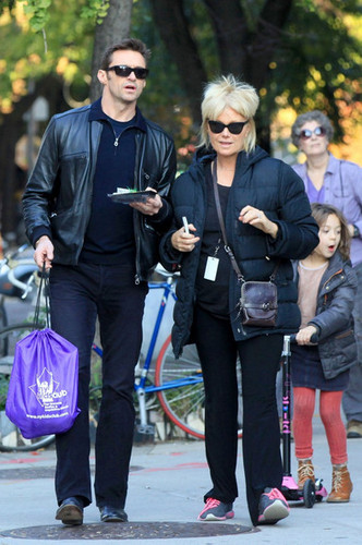 Hugh Jackman walks with his wife and daughter