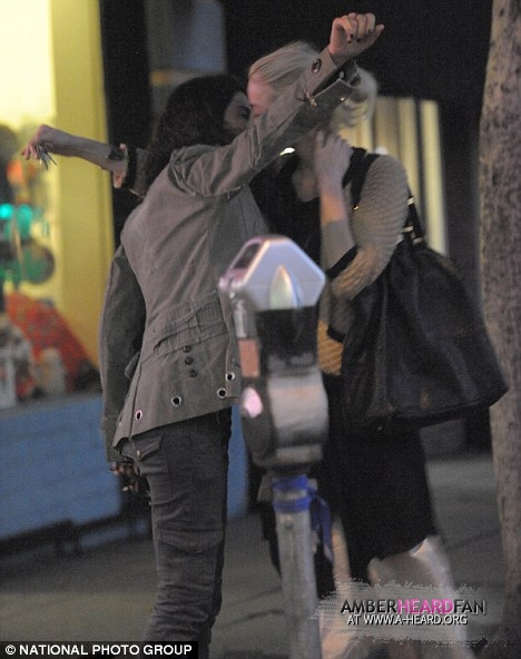 Sharing a kiss with Francesca Gregorini in LA November 18th Amber Heard