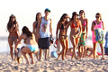 justin besieged by girls on the beach  - justin-bieber photo