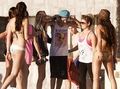 justin besieged by girls on the beach  - justin-bieber photo