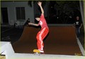 ustin-bieber-red-shirt-skateboarding -01.JPG - justin-bieber photo