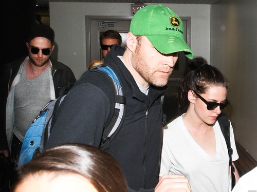  Kristen Stewart & Robert Pattinson at LAX airport in Los Angeles, California - March 8, 2012.