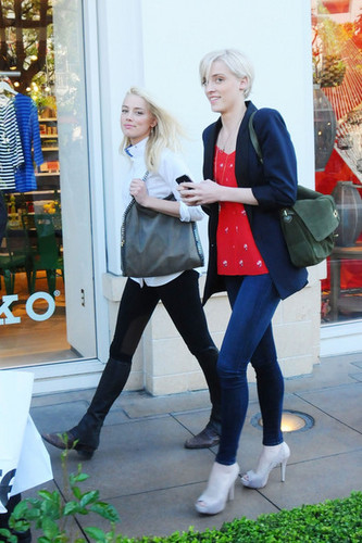  Amber Heard sneaks a smile while out with a friend in Los Angeles