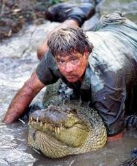 Steve Irwin crawling on a huge crocodile
