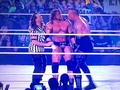 undertaker helping triple H - wwe photo