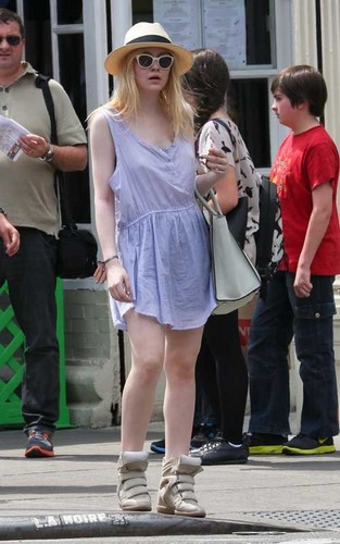  Dakota Fanning walking in downtown New York City (April 16).