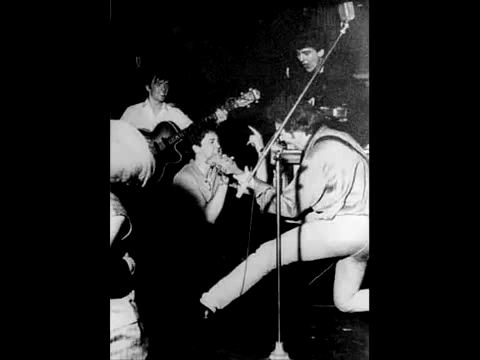 George, John, Paul and Stu on the stage 2 (at the Top Ten Club Hamburg 1961)