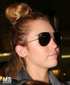 14/05 Arriving From A Flight With Tish and Brandi In Miami - miley-cyrus photo