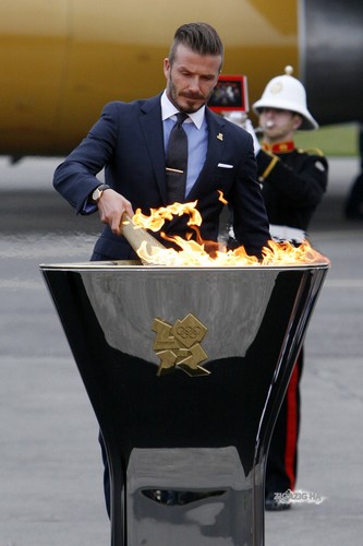 David With The London 2012 Olympic Games Flame At Royal Naval Air Station