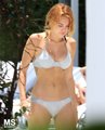 13/06 In The Pool Of Her Hotel In Miami - miley-cyrus photo