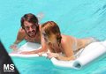 13/06 In The Pool Of Her Hotel In Miami - miley-cyrus photo