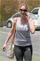 Jennifer Lawrence uses her phone while arriving at the gym with a friend on Thursday (June 21)  - jennifer-lawrence photo
