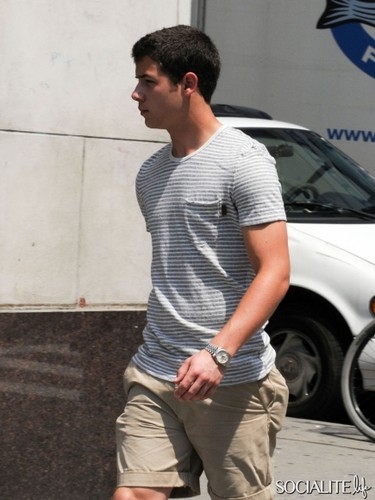hotter pics of Nick getting Jamba Juice and getting in a taxi