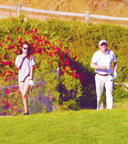  Kristen playing golf with her dad in Malibu