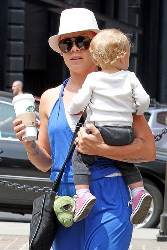 Pink helps Willow take some of her first steps as she leaves her hotel with Carey Hart [July 15]
