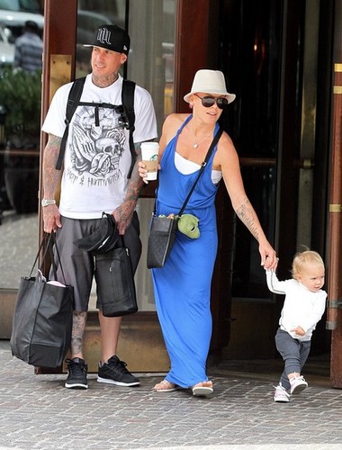 Pink helps Willow take some of her first steps as she leaves her hotel with Carey Hart [July 15]