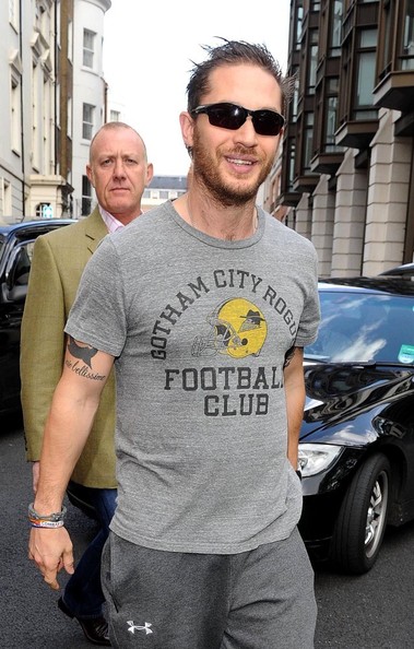 Tom Hardy wears sweatpants and a Gotham City football t-shirt as he leaves ...