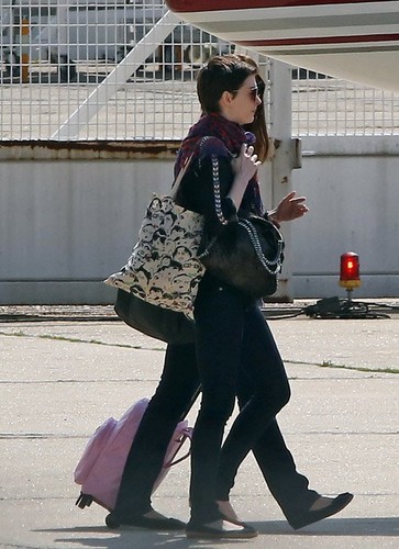  Anne spotted leaving Paris after "The Dark Knight Rises" premiere
