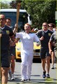 Rupert Grint carring the Olympics Torch - harry-potter photo