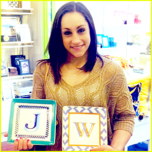 Jordyn Wieber Holding Plates with Initials on Them