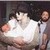  MJ holding a baby in his arms