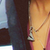 The paper airplane necklace