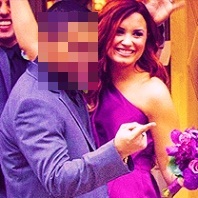 Who's in this picture with Demi?
