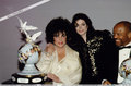  Who is this man with Michael and Dame Elizabeth Taylor