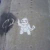 LOL look at what someone graffitied on a pole at my nearest mall its a squirtle and a batman signal  eeveegirl95 photo